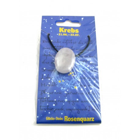 Linsenstein gebohrt mit Band auf Astro-Karte  Krebs/Rosenquarz